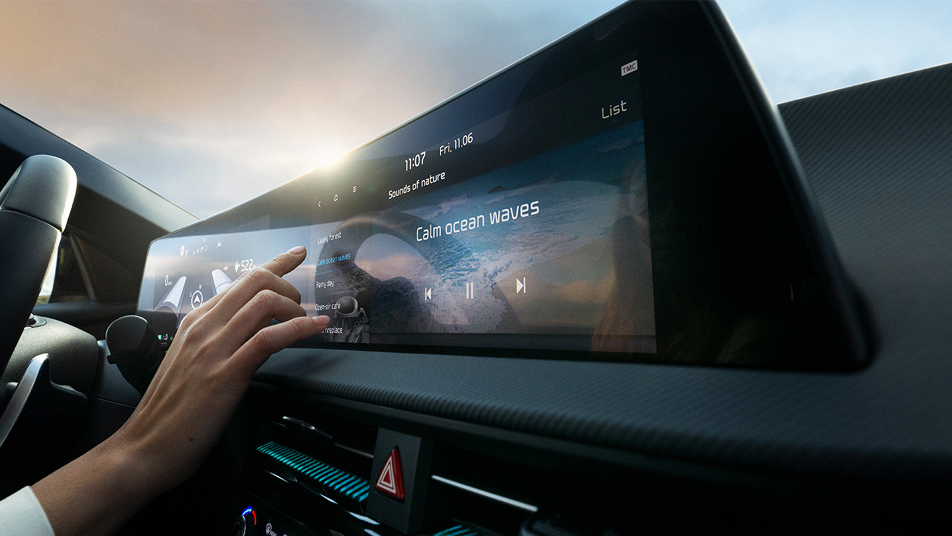 Hand of a woman selecting music at center display